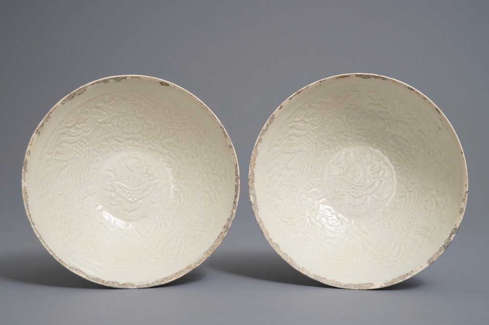 A pair of Chinese qingbai moulded 'phoenix' bowls, Song