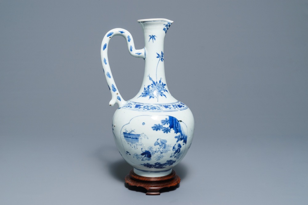 A Chinese blue and white jug with figurative medallions, Transitional period