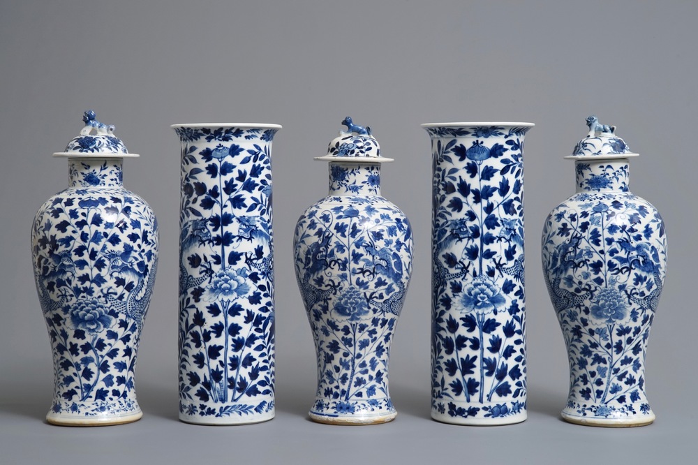 A Chinese blue and white five-piece garniture with dragons, Kangxi marks, 19th C.