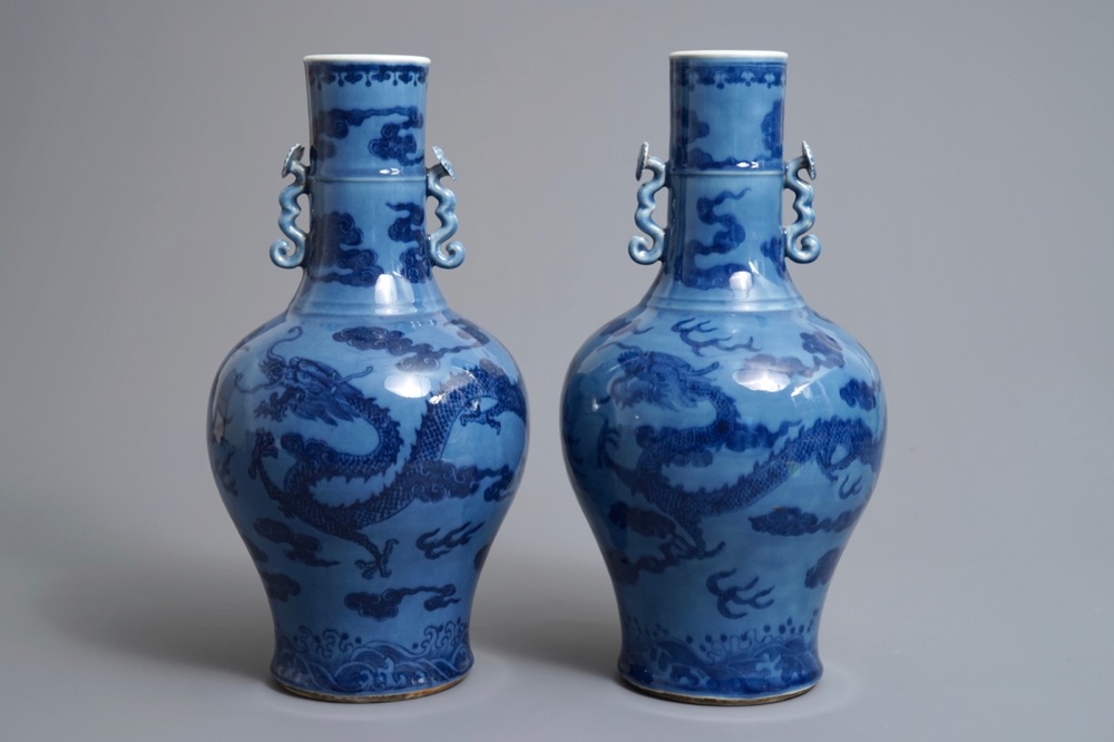 A pair of Chinese lavender blue vases with underglaze dragons, 18/19th C.