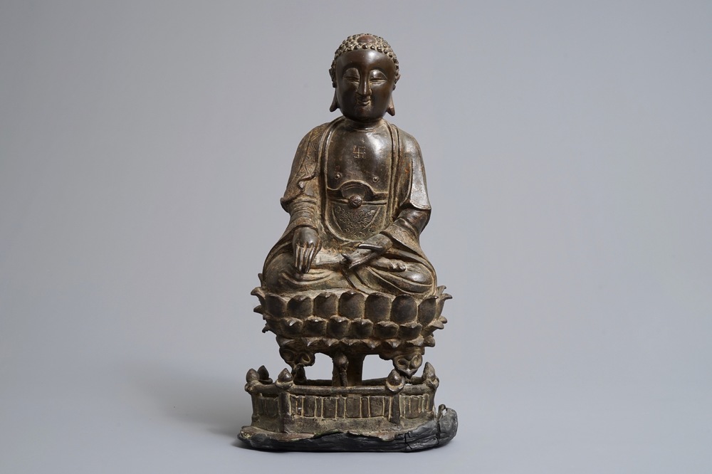 A Chinese bronze figure of Buddha Shakyamuni on lotus throne, Ming