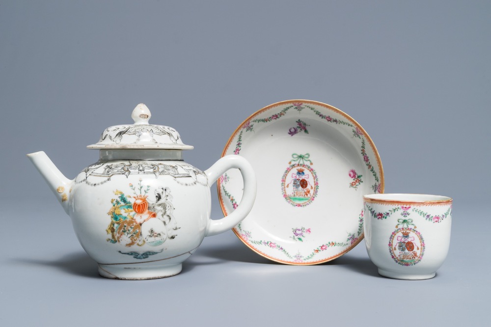A Chinese grisaille and famille rose armorial teapot and cup and saucer, Qianlong