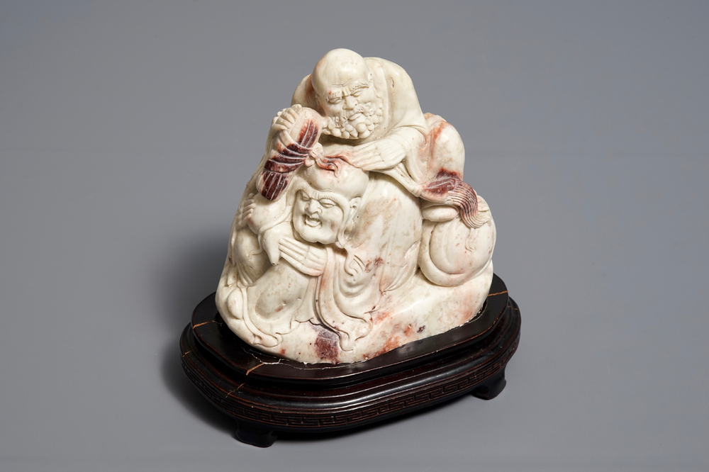 A Chinese Shoushan soapstone 'immortals' group, 19th C.