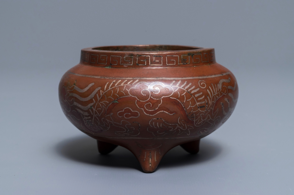 A Chinese silver-inlaid bronze incense burner, Xuande mark, 19th C.