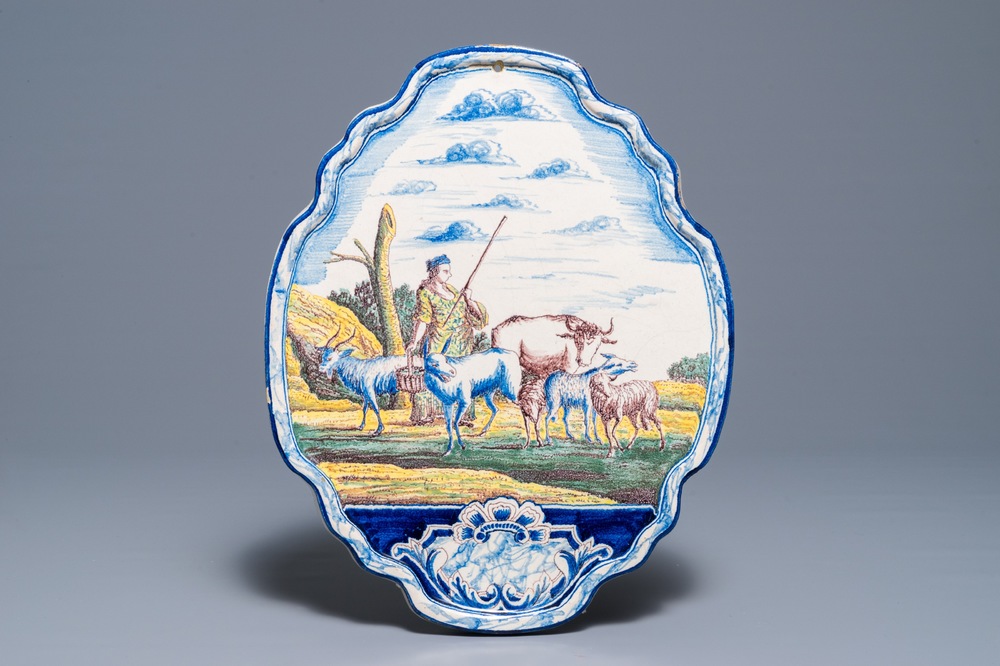 A polychrome Dutch Delft 'shepherdess' plaque, 19th C.