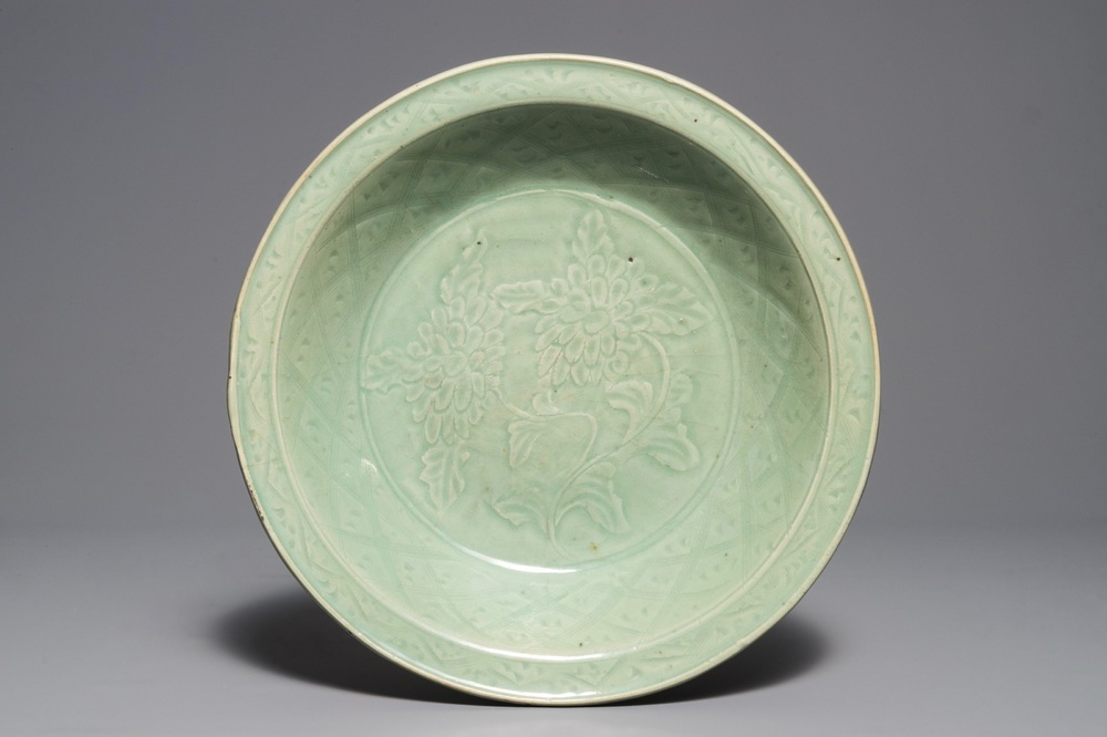 A Chinese Longquan celadon dish with underglaze design of peonies, Ming
