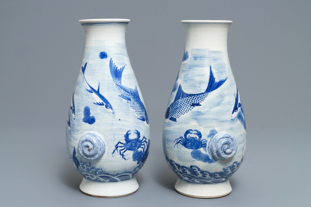 A pair of Chinese blue and white 'fish and crab' vases, Kangxi mark, 19th C.