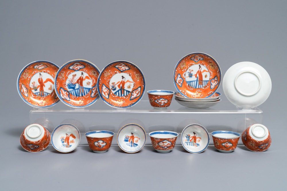 Nine Chinese iron red and gilt cups and eight saucers, Kangxi