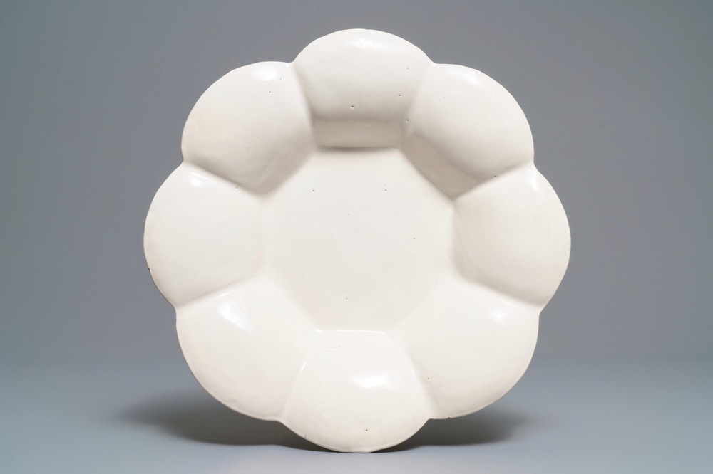 A large white Dutch Delft gadrooned dish, 17th C.