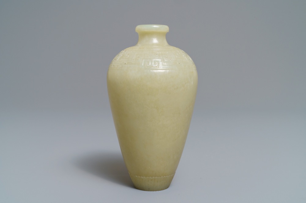A Chinese light celadon jade relief-decorated meiping vase, 19/20th C.