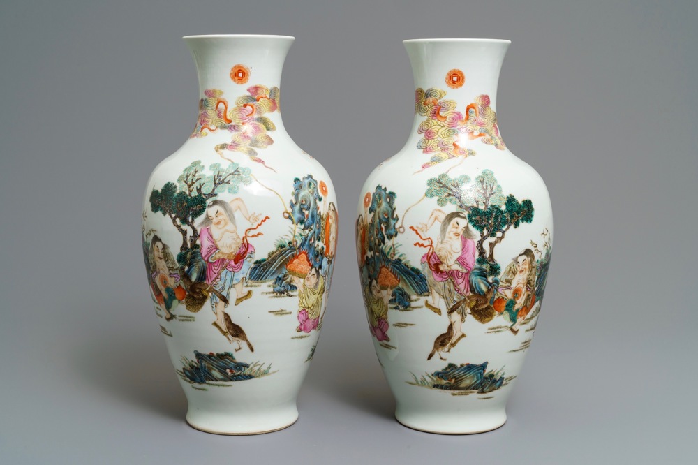 A pair of Chinese famille rose vases, Qianlong mark, 20th C.