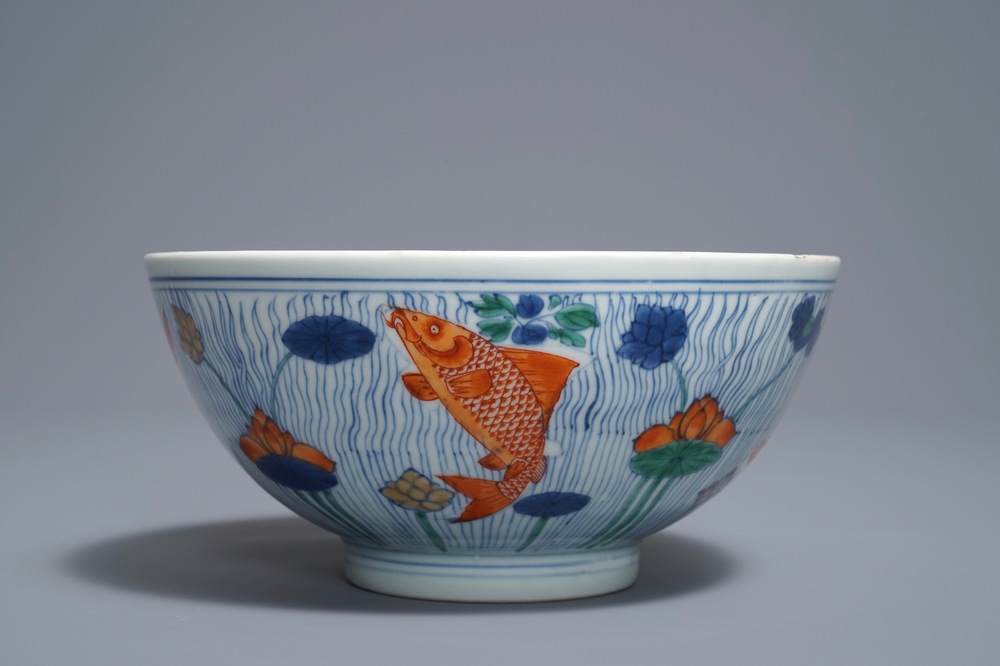 A Chinese doucai bowl with fish in a lotus pond, Xuande mark, Kangxi