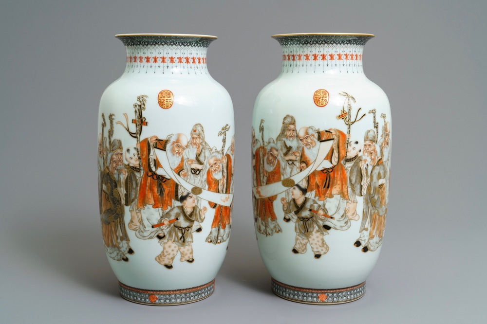 A pair of Chinese iron red, grisaille and gilt vases, Qianlong mark, 20th C.