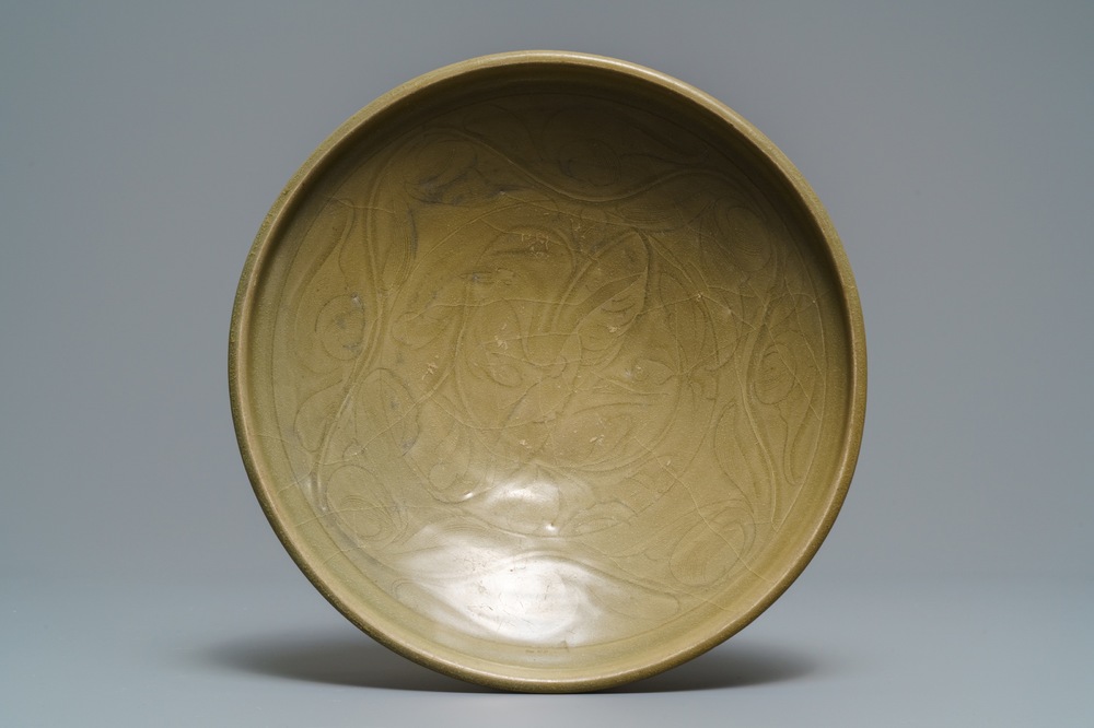 A Chinese Yaozhou celadon bowl with incised floral design, Song