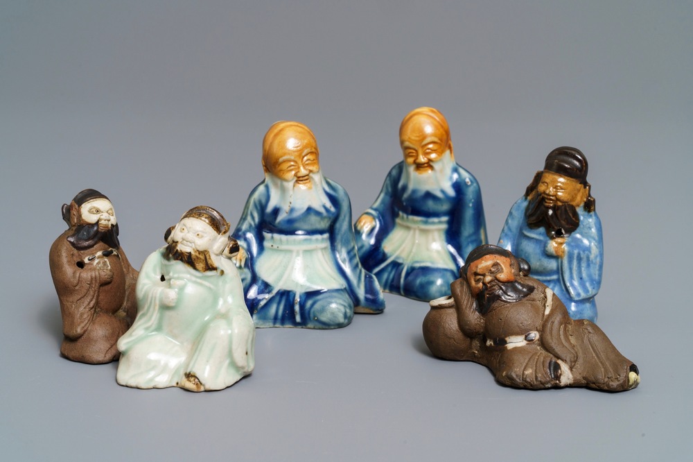 Six Chinese blue, white and celadon biscuit figures, Qianlong