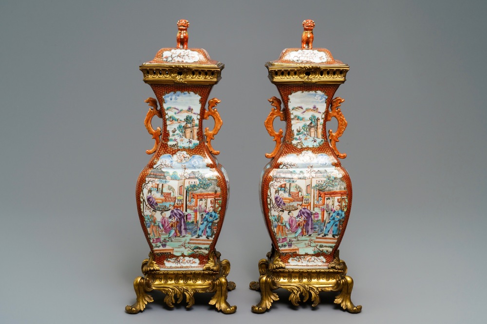 A pair of large Chinese ormolu-mounted famille rose 'mandarin' vases and covers, Qianlong