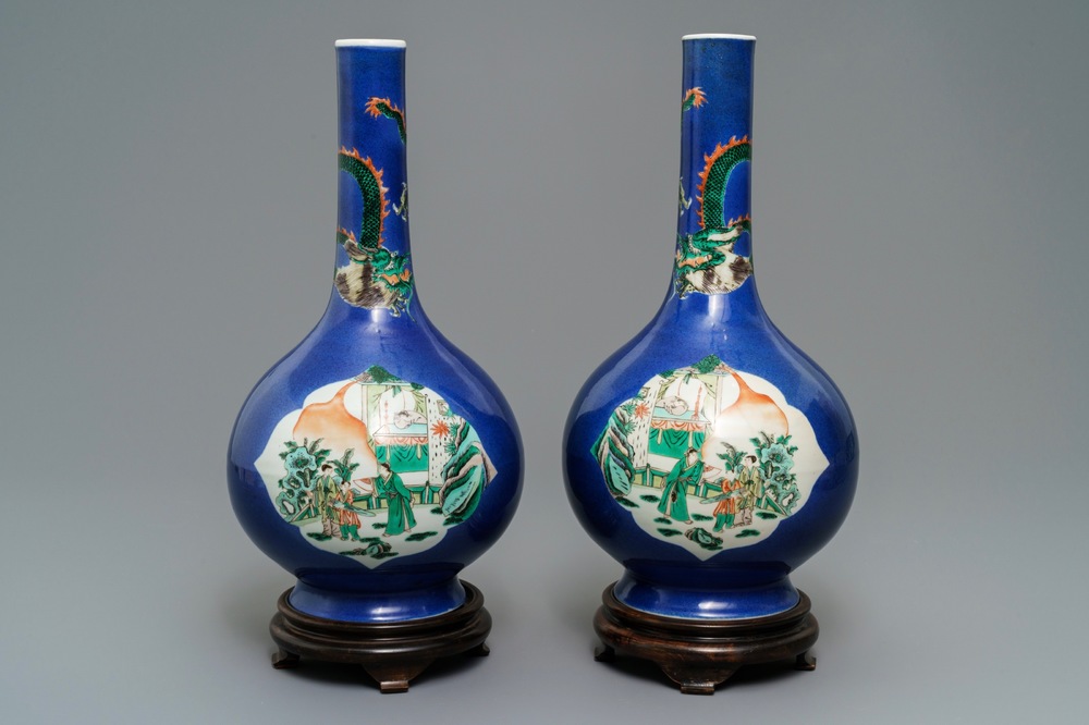 A pair of Chinese famille verte powder blue-ground bottle vases, 19th C.