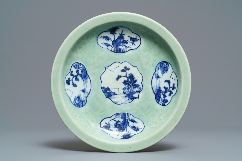 A Chinese celadon-ground dish with blue and white landscape medallions, 18/19th C.
