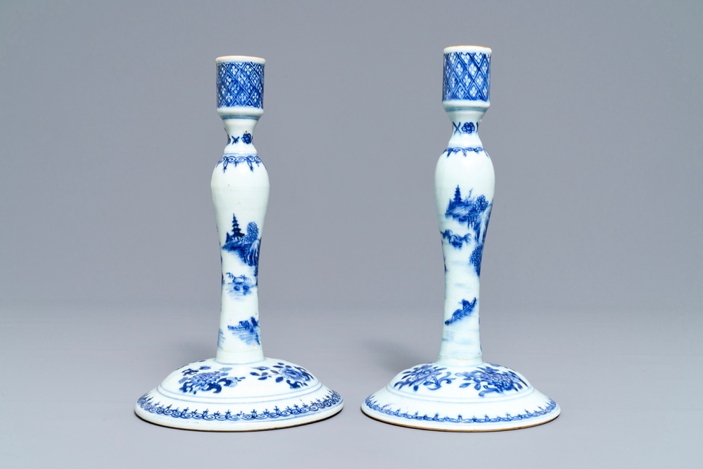 A pair of Chinese blue and white candlesticks, Kangxi/Qianlong