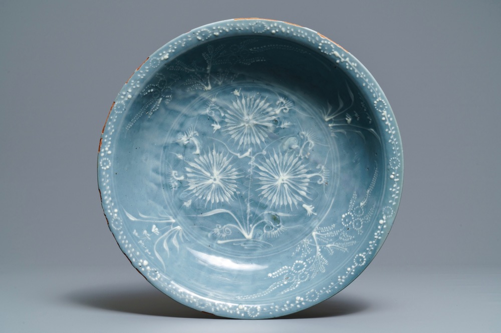 A Chinese Swatow celadon slip-decorated blue-ground dish, Ming