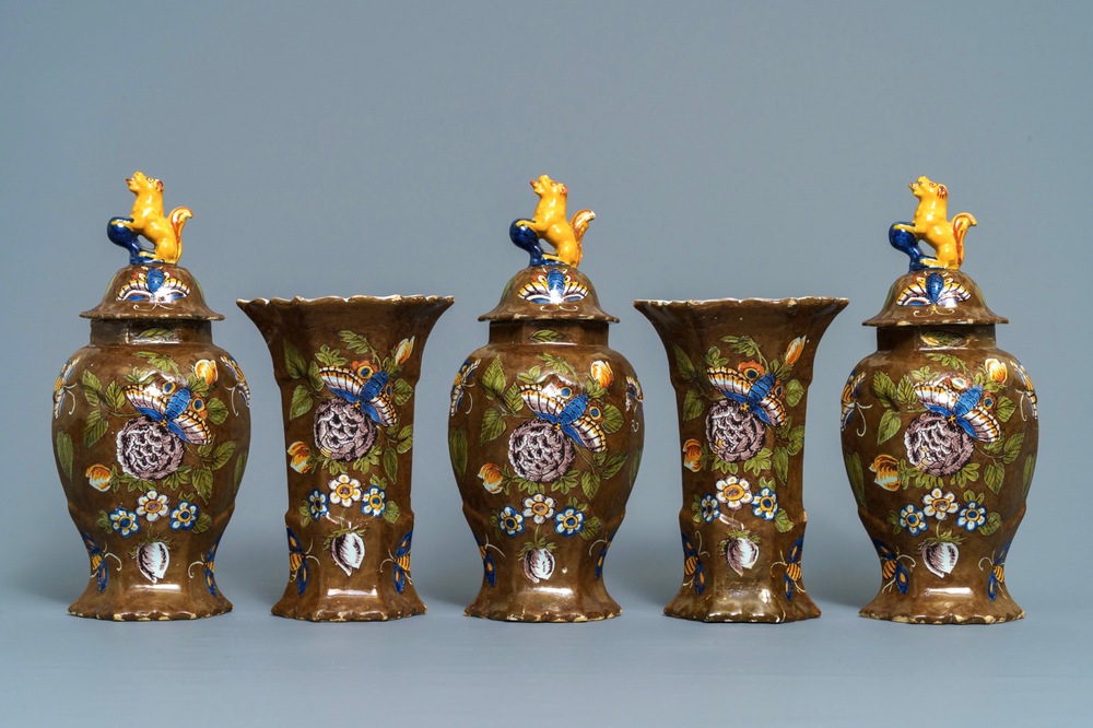 A polychrome Dutch Delft five-piece 'capucin brown-ground' garniture, 18th C.