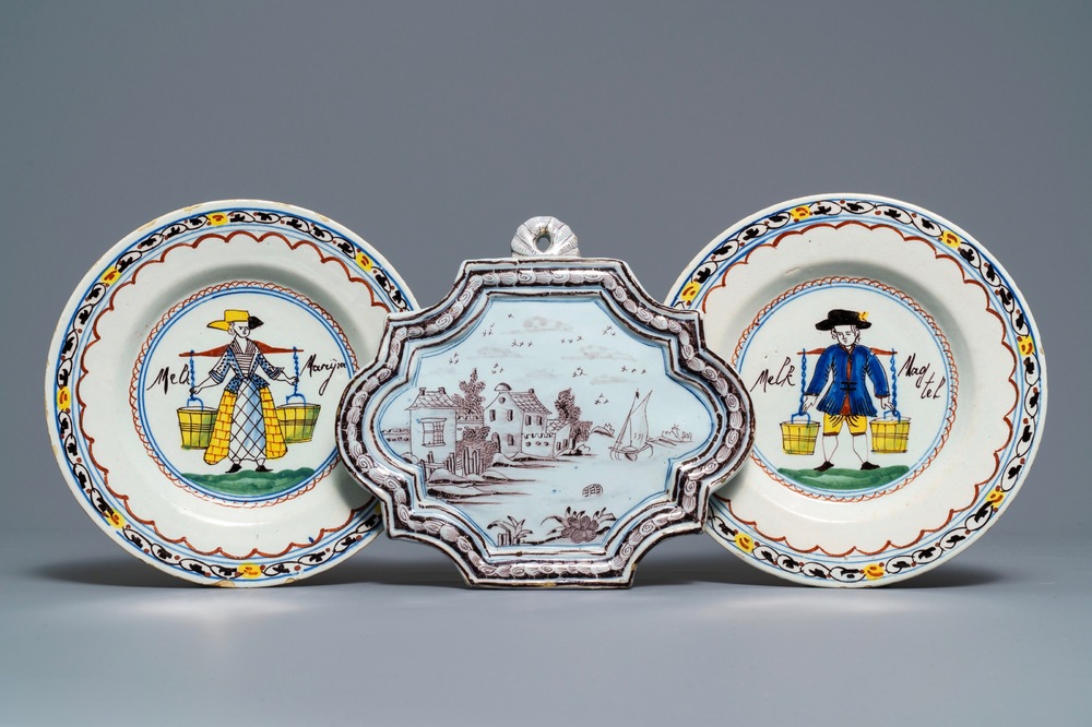 A pair of polychrome Dutch Delft 'Milkmaid' plates and a blue and manganese plaque, 18th C.