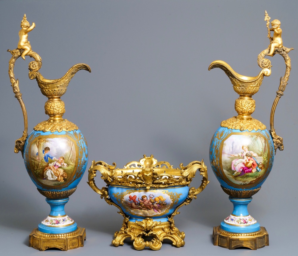 A pair of massive gilt bronze-mounted S&egrave;vres porcelain ewers and a jardini&egrave;re, France, 19th C.