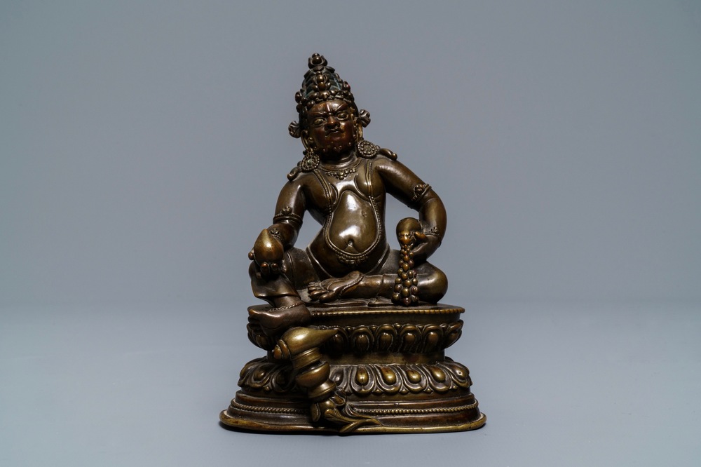 A Sino-Tibetan bronze figure of Jambhala, 17/18th C.
