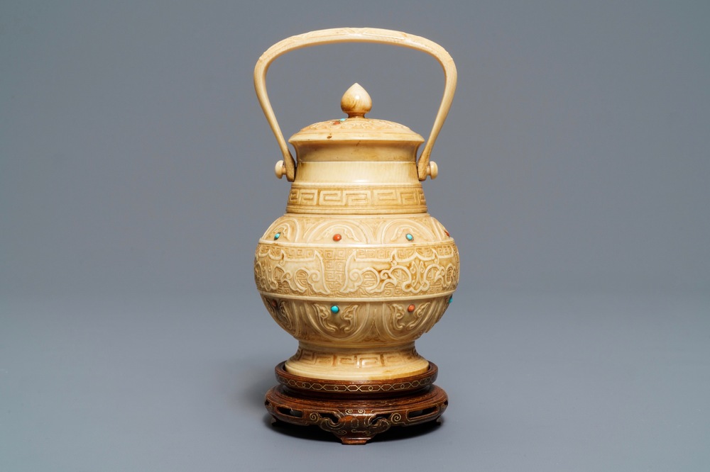 A Chinese coral and turquoise-inlaid ivory vase and cover, 1st half 20th C.