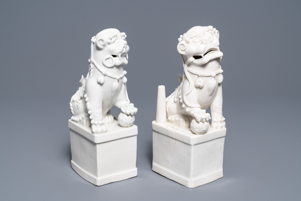 A pair of large Chinese Dehua blanc de Chine buddhist lion joss stick holders, Kangxi