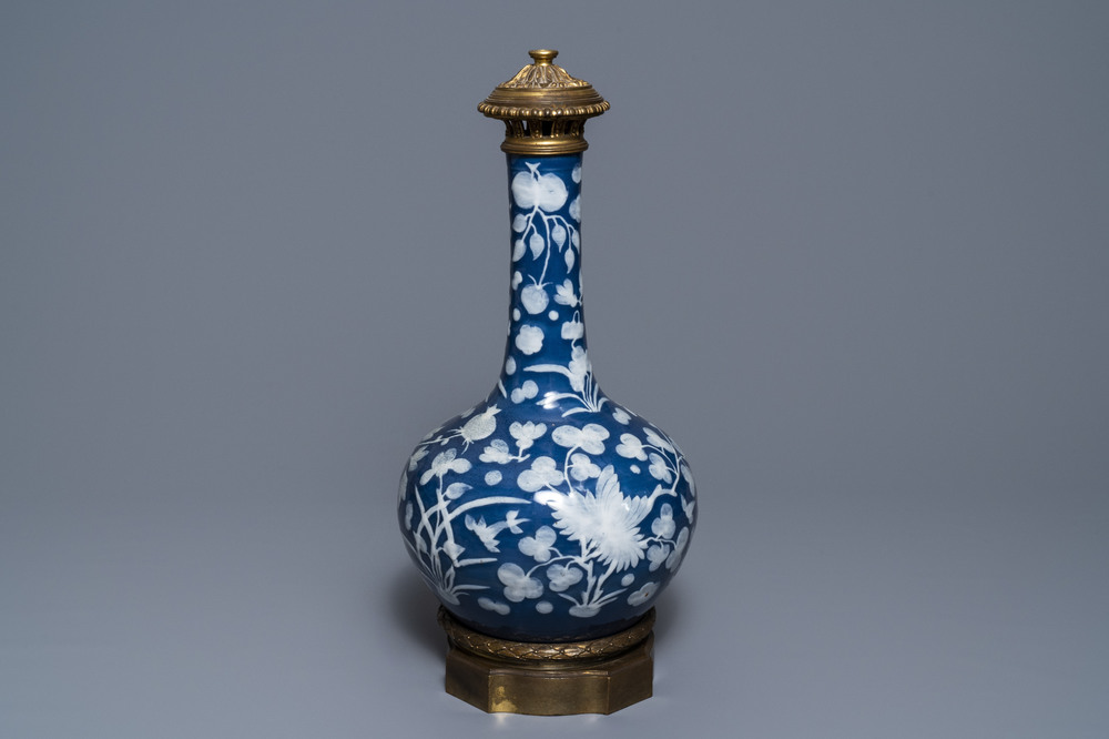 A Chinese blue-ground slip-decorated bottle vase with ormolu mounts, 19th C.