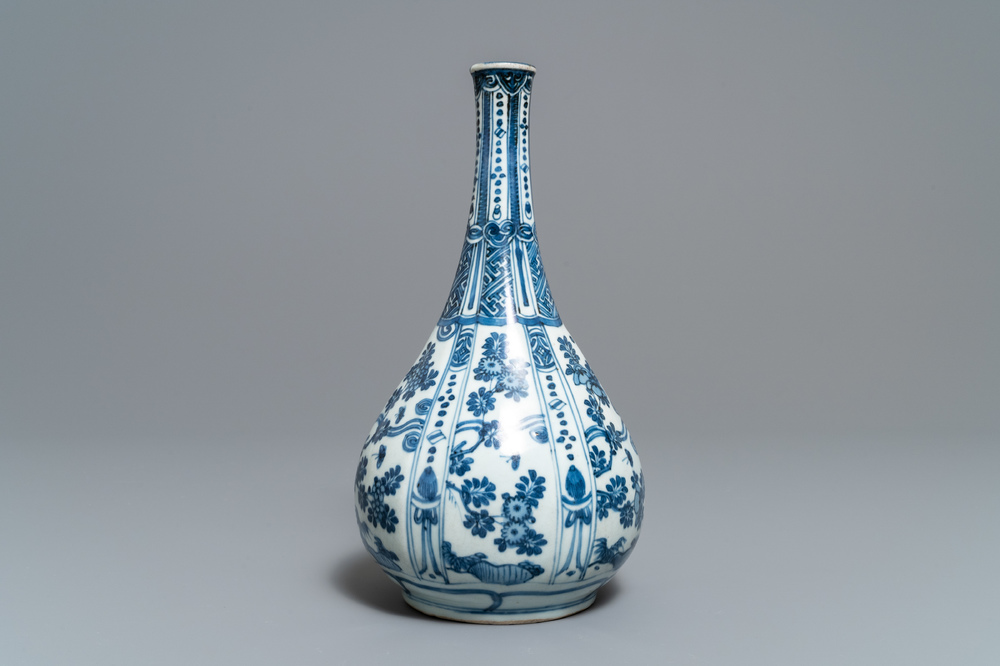A Chinese blue and white bottle vase with flowers, Wanli