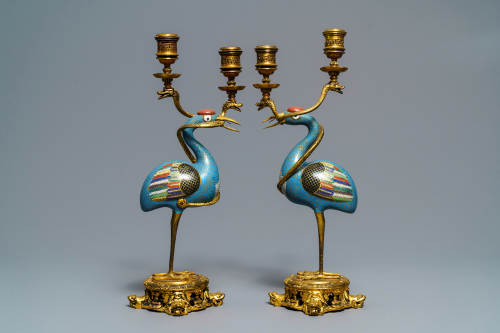 A pair of Chinese cloisonn&eacute; gilt bronze candelabra mounted cranes, 18/19th C.