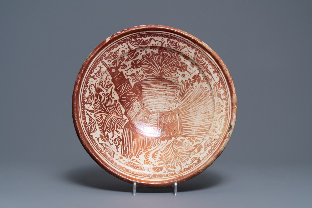 A large Hispano-Moresque lusterware charger with a bird, Valencia or Manises, Spain, 16/17th C.