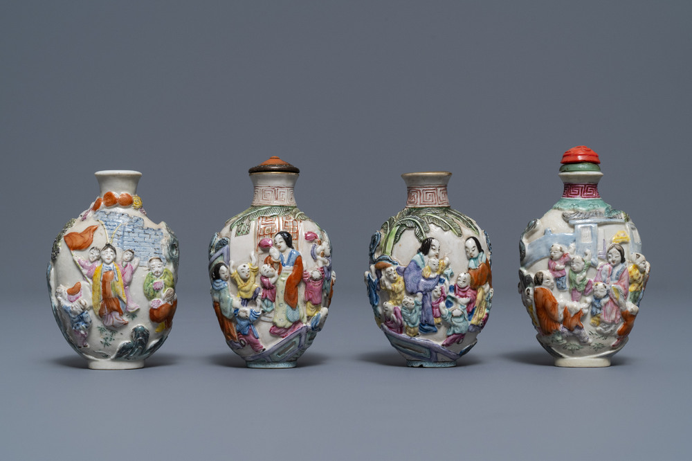 Four Chinese famille rose porcelain relief-decorated snuff bottles, 19th C.