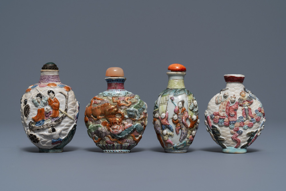 Four Chinese famille rose porcelain relief-decorated snuff bottles, 19th C.