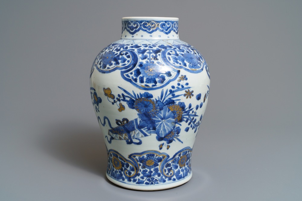 A Chinese gilt-decorated blue and white vase with floral design, Kangxi