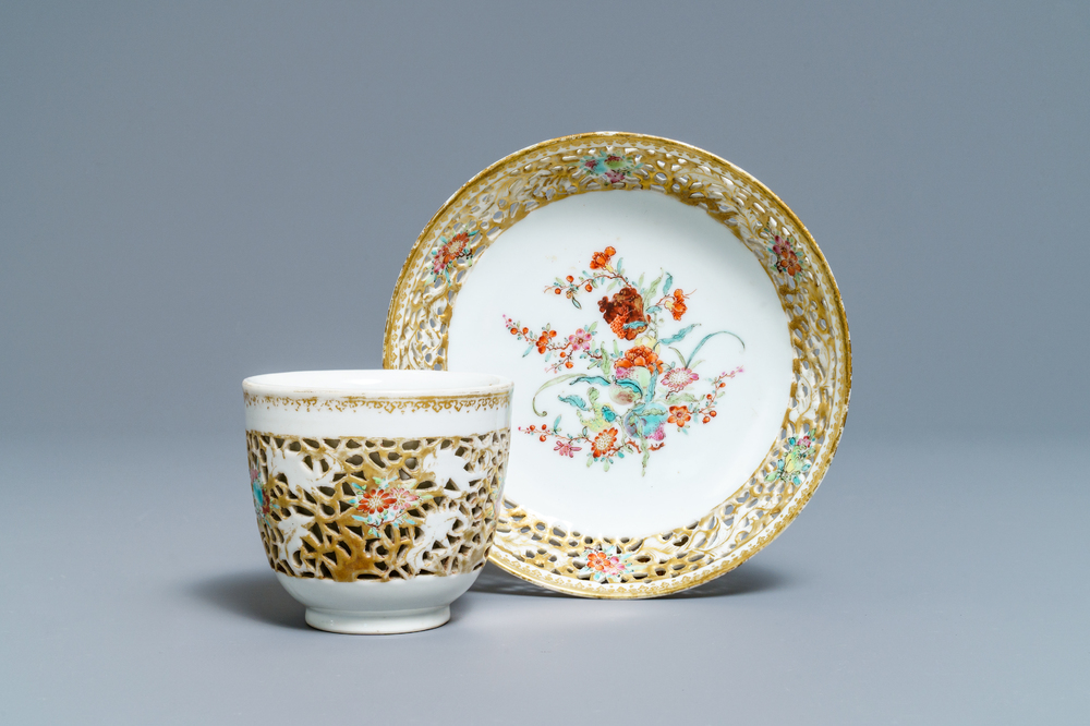 A reticulated Chinese famille rose cup and saucer, Qianlong