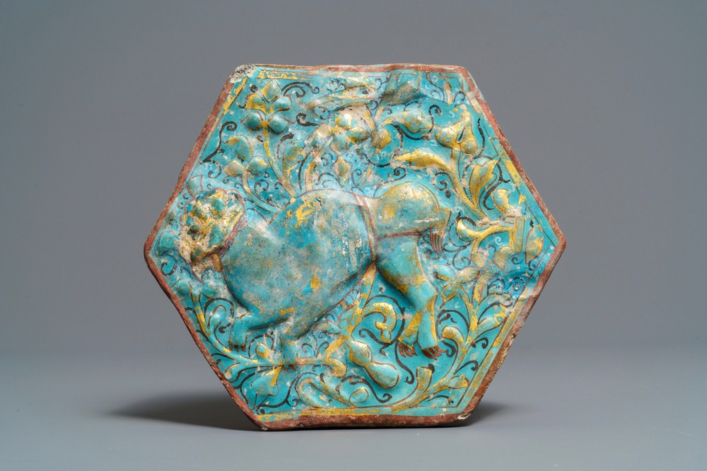 A hexagonal Lajvardina-glazed turquoise-ground tile, Kashan, Iran, 13th C.