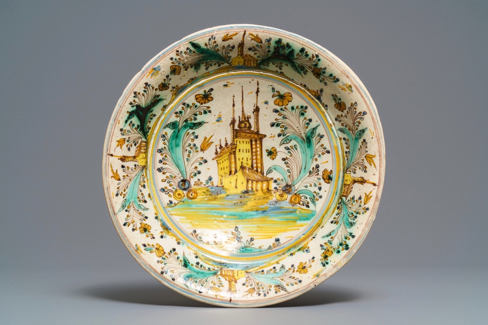 A polychrome Spanish dish with a castle in a landscape, Talavera, 17/18th C.