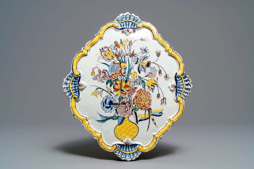 A large polychrome Dutch Delft 'flower vase' plaque, 18th C.