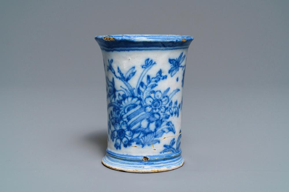 An extremely rare inscribed Dutch Delft blue and white beaker after a silver example, dated 1676