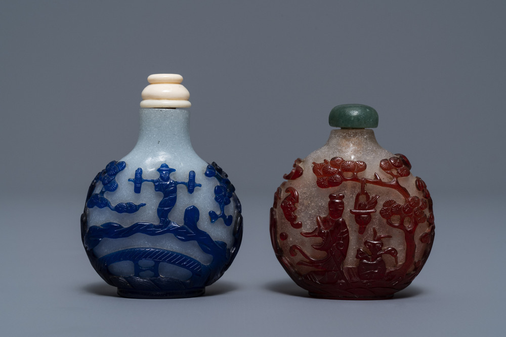 Two Chinese overlay red and blue snowflake glass snuff bottles, 19th C.