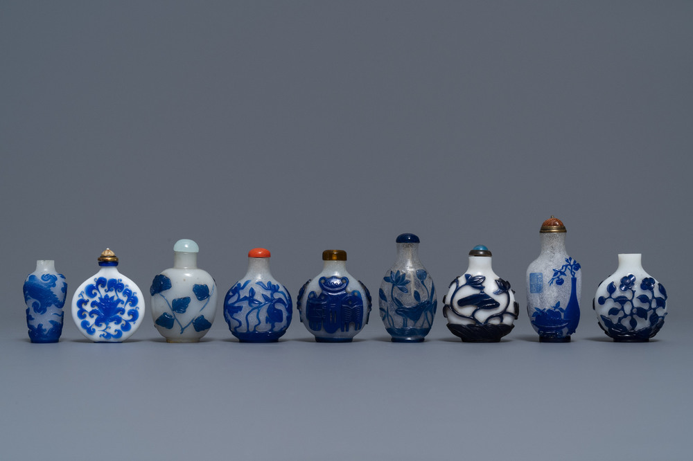 Nine various Chinese blue overlay and transparent glass snuff bottles, 19/20th C.