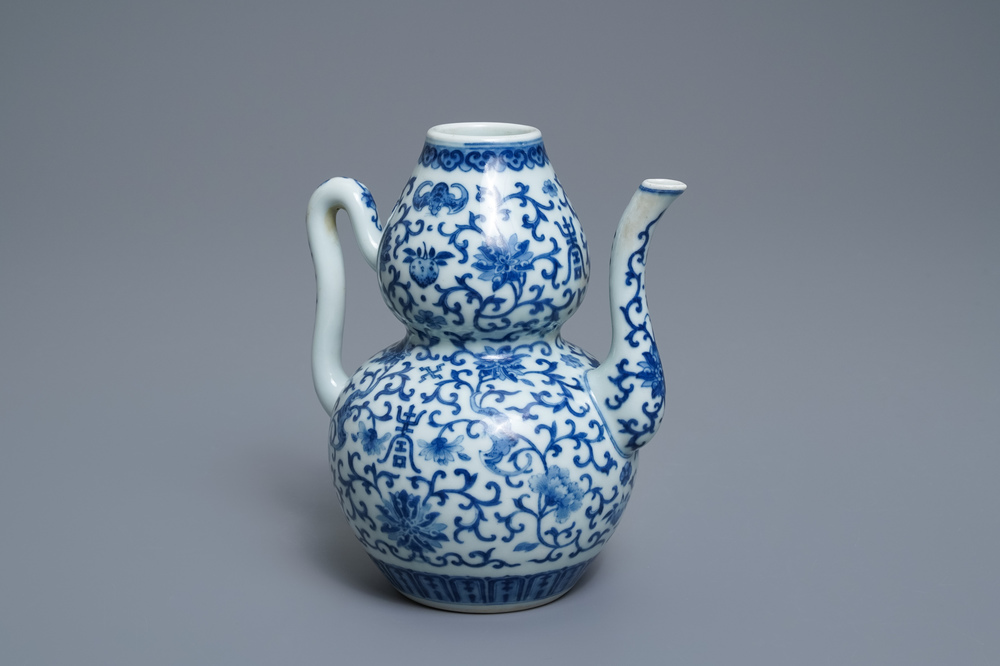 A Chinese blue and white 'bats and shou' jug, 19th C.