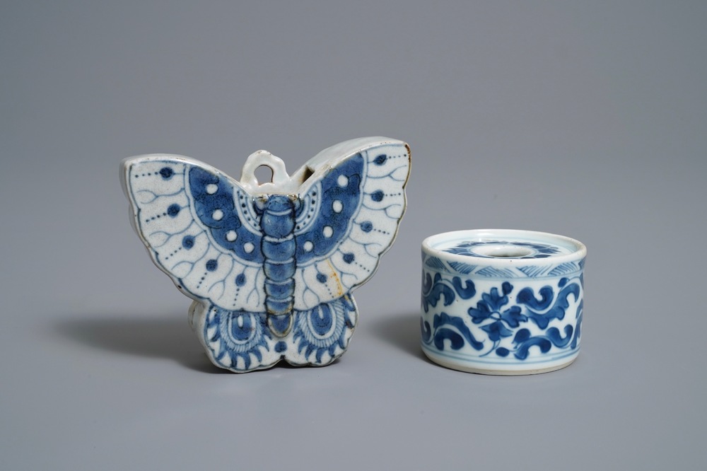 A Chinese blue and white butterfly wall pocket vase and an inkwell, Kangxi/Qianlong