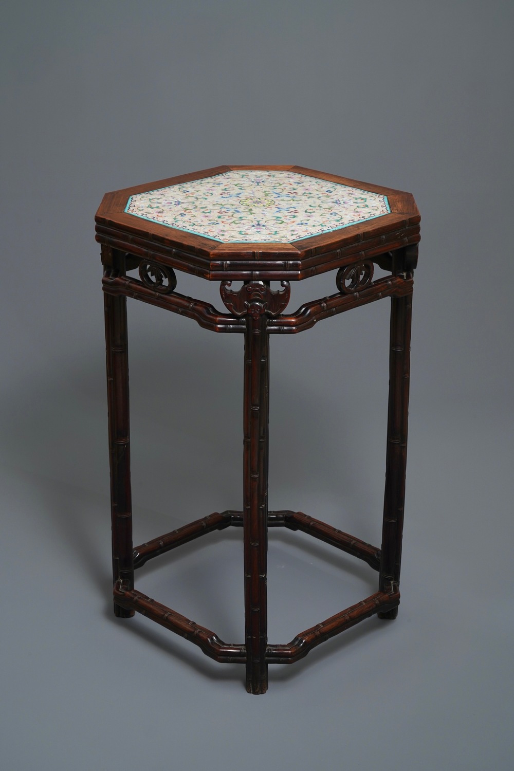 A Chinese huali wooden stand with famille rose plaque, Jiaqing