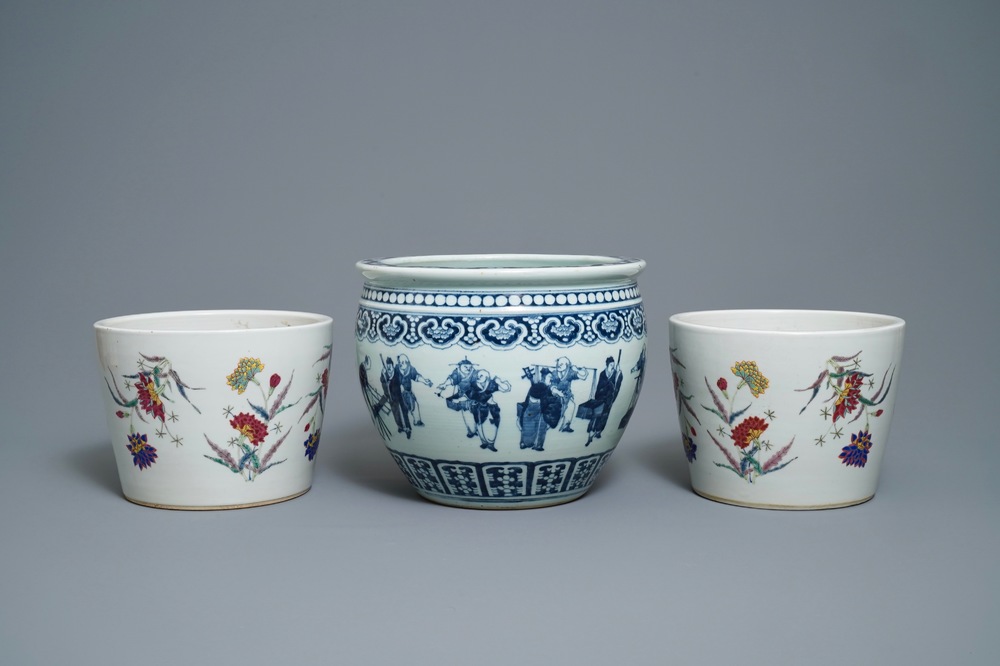 A pair of Chinese famille rose jardini&egrave;res and a blue and white example, 19th C.