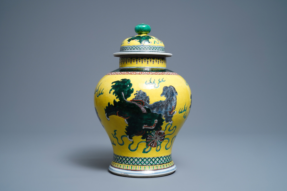 A Chinese yellow-ground famille verte vase and cover with Buddhist lions, 19th C.