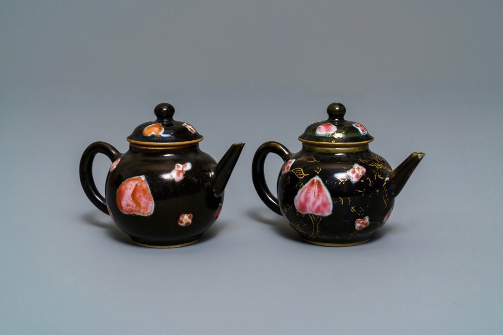 A pair of Chinese famille rose black-ground teapots and covers, Yongzheng/Qianlong